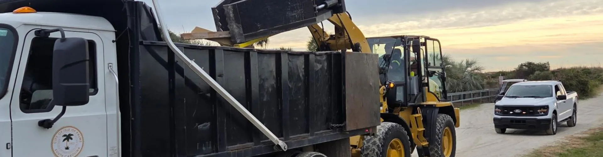 Digger loading a dump truck